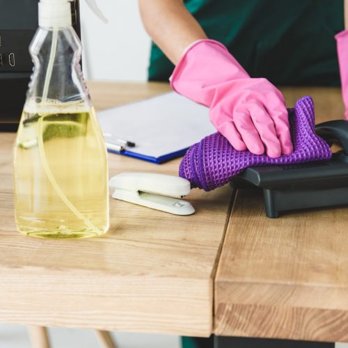 Commercial Cleaning Brisbane - person cleaning office equipment